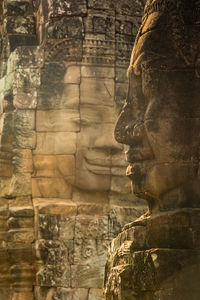 Faces of king yayavarmann vii on the beautiful bayon temple, angkor wat, cambodia