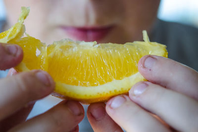 Close-up of hand holding fruit