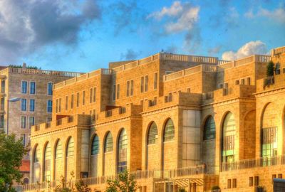 Low angle view of building against cloudy sky