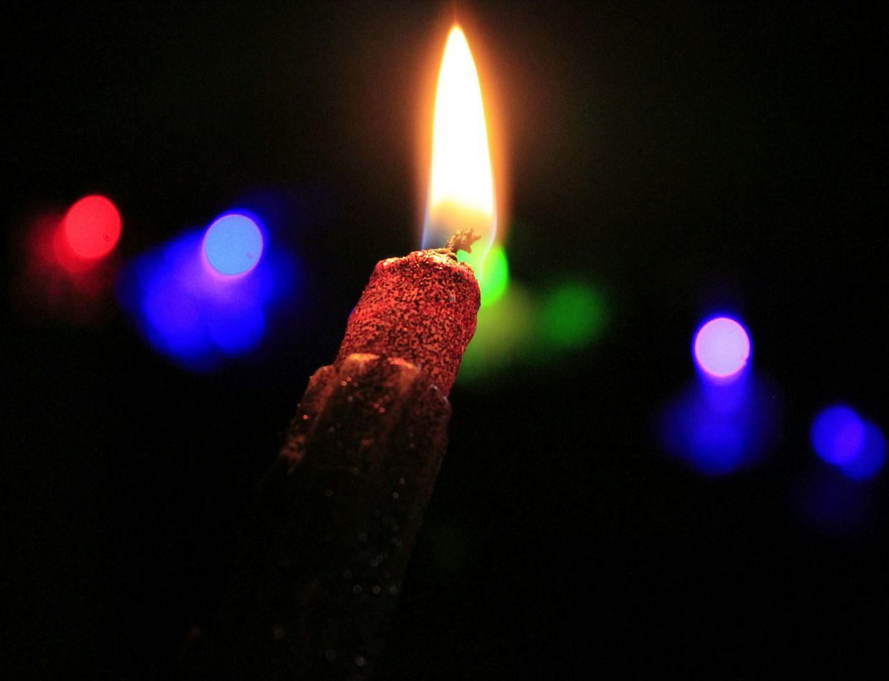 flame, burning, illuminated, night, glowing, fire - natural phenomenon, candle, heat - temperature, close-up, lit, indoors, light - natural phenomenon, focus on foreground, black background, dark, fire, lighting equipment, celebration, no people, selective focus