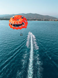 Boat sailing in sea against sky