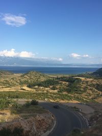 Scenic view of landscape against blue sky