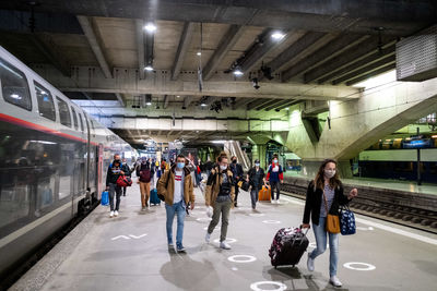 People waiting at railroad station platform