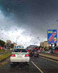 Cars on road in rainy season
