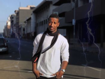 Portrait of smiling young man standing outdoors