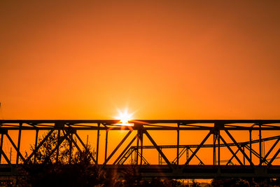 Silhouette of bridge against sky during sunset