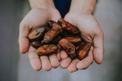 Close-up of hand holding date