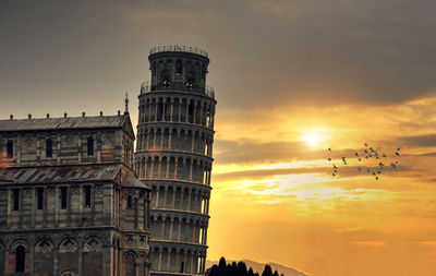 Low angle view of building against sky during sunset