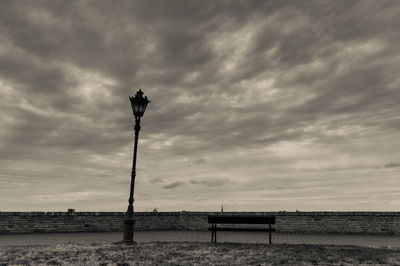 Lifeguard hut on beach against sky