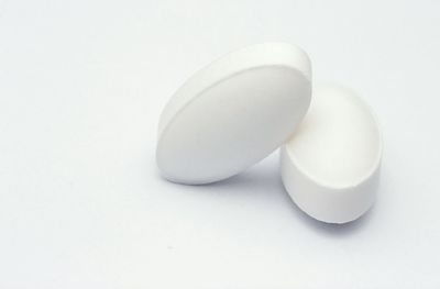 Close-up of spoon over white background