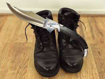 High angle view of shoes on hardwood floor