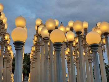 Low angle view of illuminated building against sky