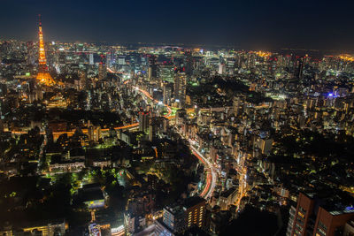 High angle view of illuminated city buildings at night