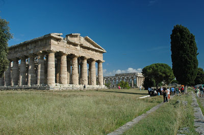 Group of people in front of historical building