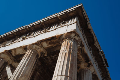 Low angle view of historic building against clear blue sky