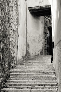 Steps amidst walkway against sky