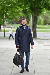 Portrait of young man walking outdoors