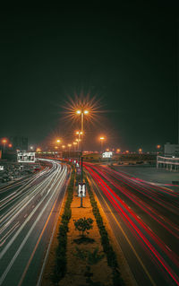 High angle view of light trails on road at night