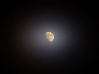 Low angle view of moon against sky at night