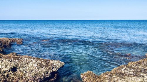 Scenic view of sea against clear sky