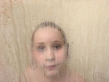 Close-up portrait of girl in water