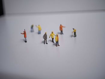 High angle view of people in toy over white background