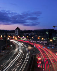 High angle view of light trails on road in city