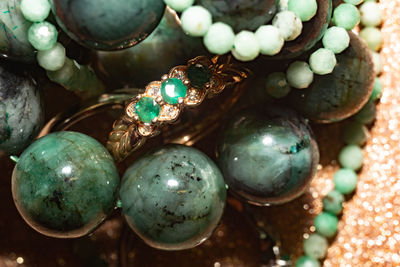 Natural emerald, beryl beaded bracelet, necklace and yellow gold ring.