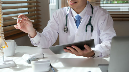 Doctor examining patient in clinic