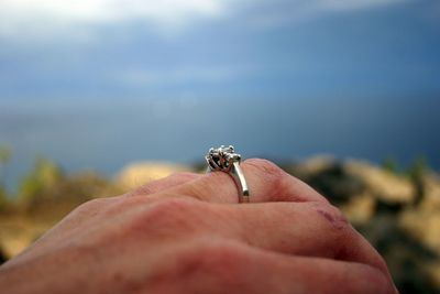 Cropped image of woman wearing engagement ring