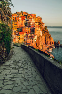 View of town by sea against sky