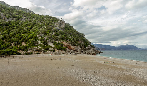 View of beach against cloudy sky