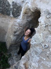 Portrait of woman on rock