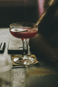 Close-up of wineglass on table