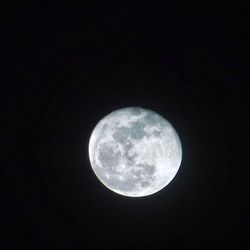 Low angle view of moon against sky at night