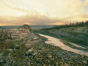 Stone mine. production of broken phonolite. main stone is clinkstone, colors of calcite or zeolite