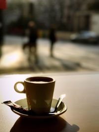 Close-up of coffee cup on table