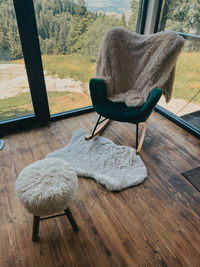 Rear view of woman sitting on chair
