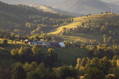 High angle view of trees and houses against mountains