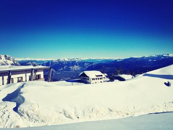 Scenic view of snow covered field against clear sky