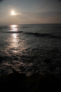 Scenic view of sea against sky at sunset