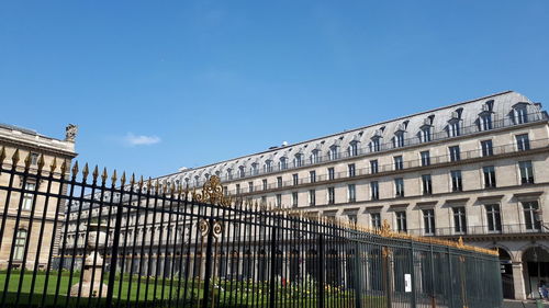 Low angle view of building against blue sky