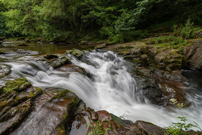 Long exposure of the waterfall at watersmeet bridge pool at watersmeet in devon