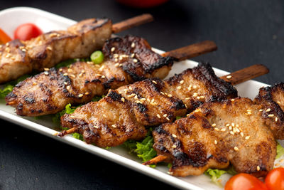 High angle view of meat on barbecue grill