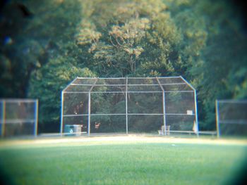 View of soccer field against trees