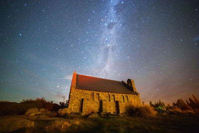 Low angle view of building against sky at night