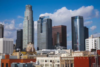 Modern buildings in city against sky