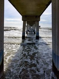 Scenic view of pier over sea against sky