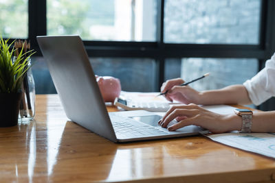 Man using laptop on table