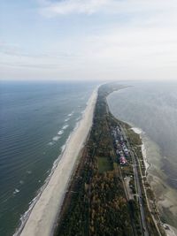 High angle view of road by sea against sky